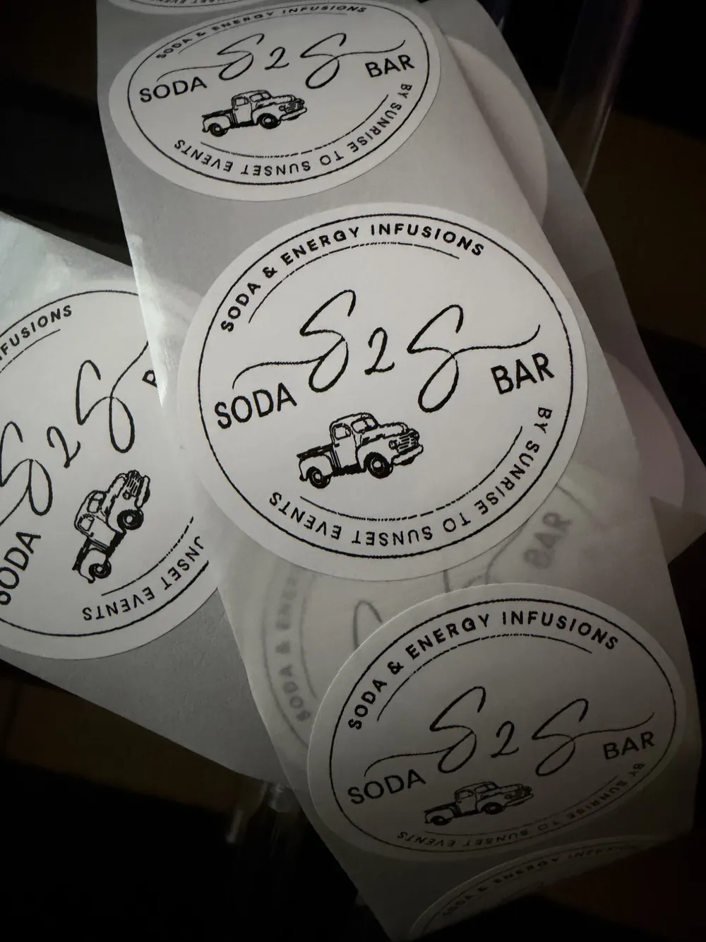 A roll of S2S Soda Bar cup stickers
